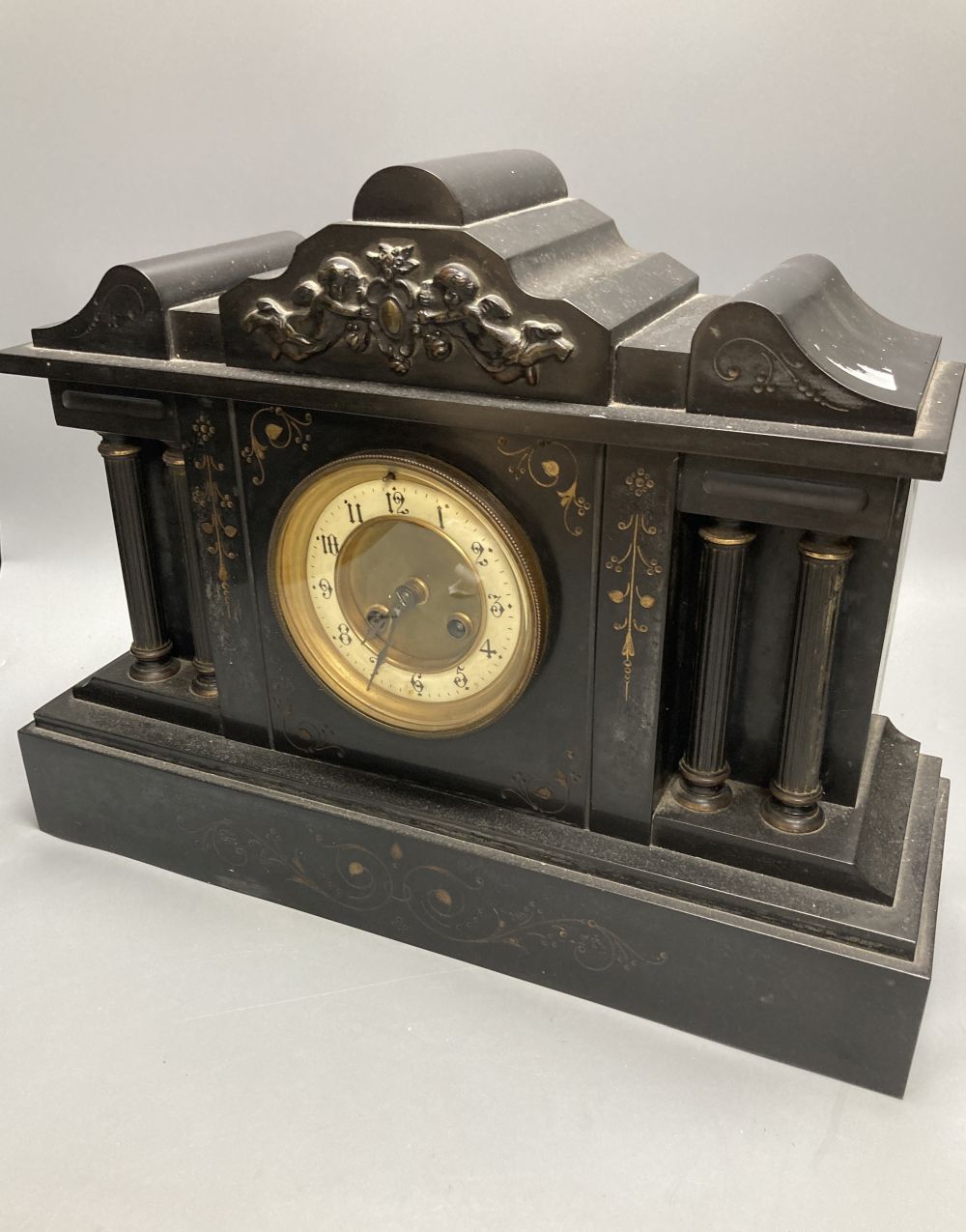 A Victorian black slate mantel clock, 43cm wide, 33cm high